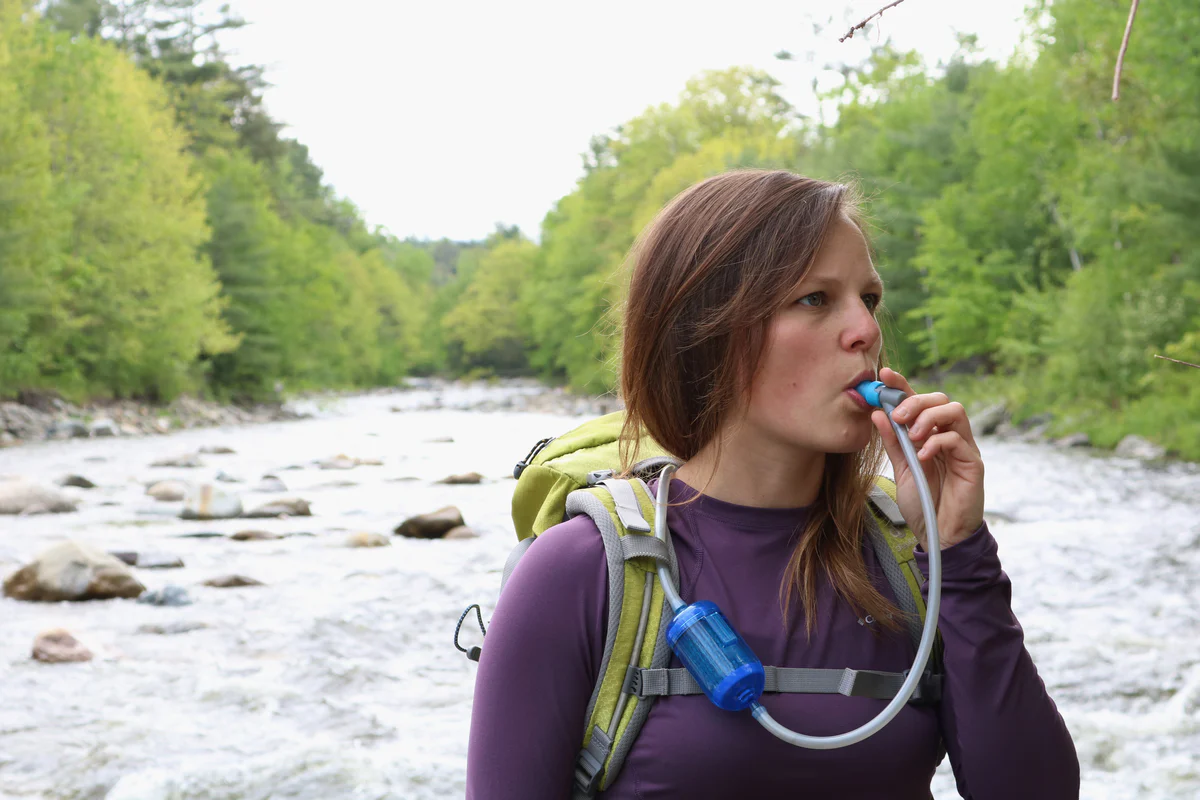 0160-0110RapidPureScout-womandrinkingthrough_2_-1200x800_5000x.webp